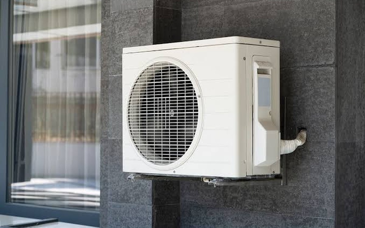 Split system air conditioning outdoor unit mounted on a wall, wired by DIM Electrical